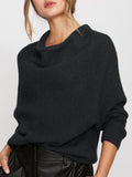 Charcoal cashmere sweater with asymmetrical cowl neck and multi-directional ribbing, styled with black leather pants.