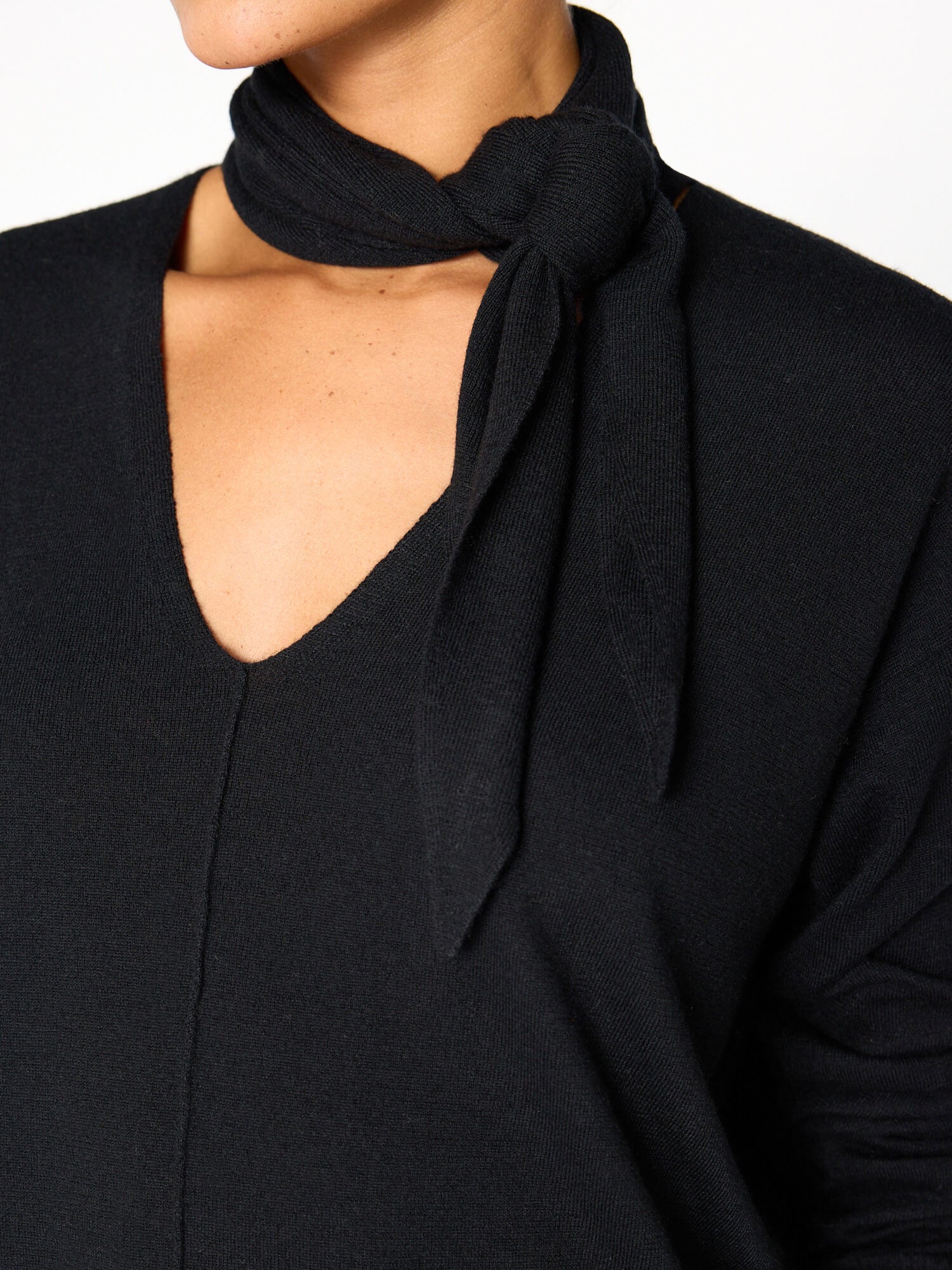 Oren tie neck black v-neck sweater close up