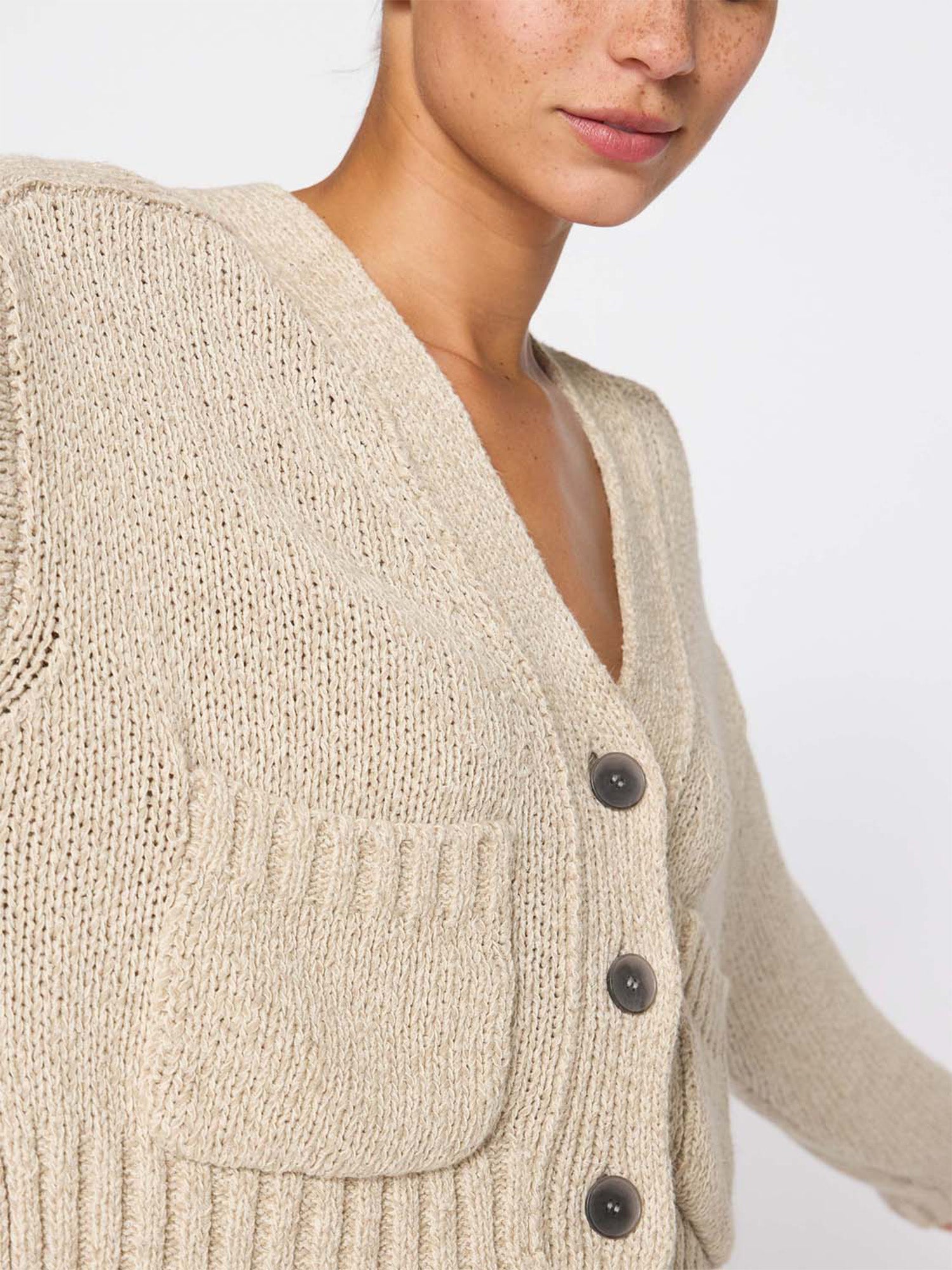 Cropped beige linen cotton cardigan sweater close up