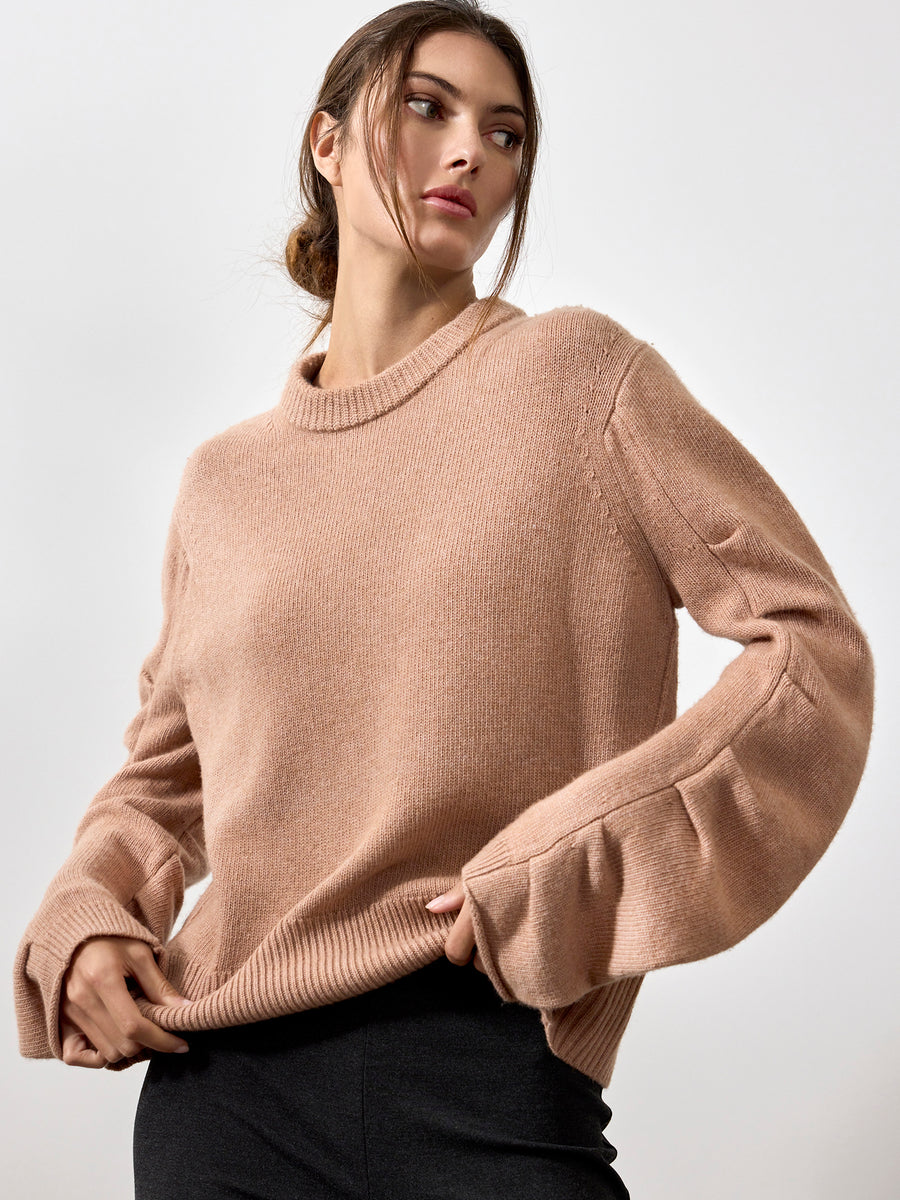 Elira peach curved sleeve crewneck sweater front view 2